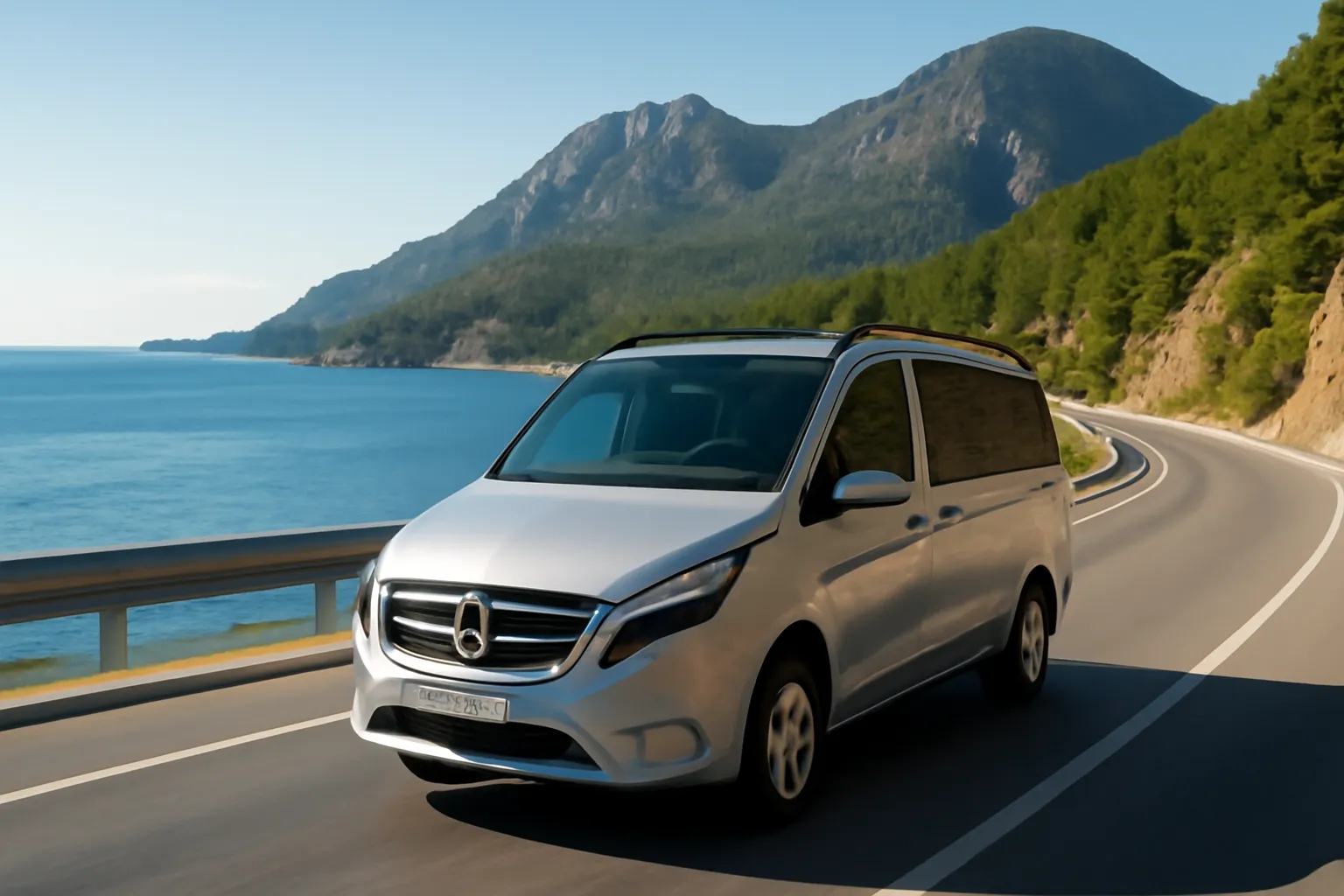 Sleek private transfer vehicle driving along coastal road from Kemer toward Antalya Airport